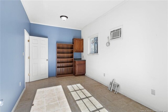 empty room featuring light tile patterned floors and a wall mounted AC