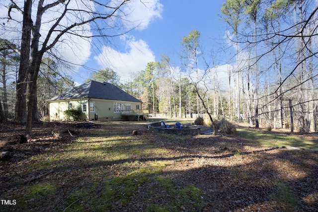 view of yard with a wooden deck