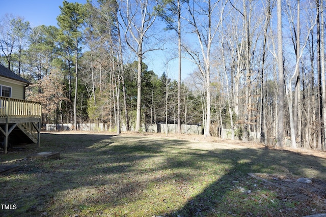 view of yard with a wooden deck