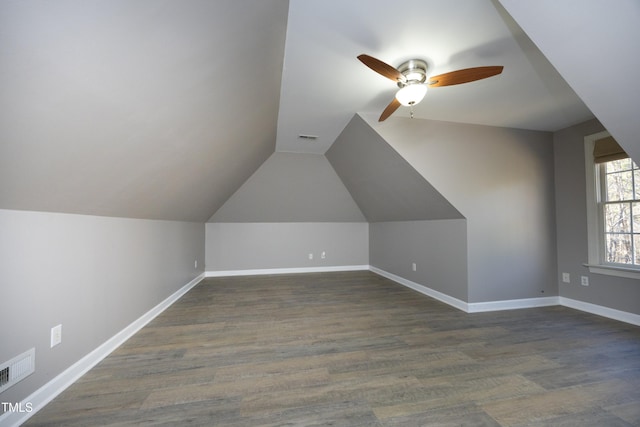 additional living space with dark hardwood / wood-style flooring, ceiling fan, and lofted ceiling