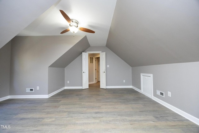 additional living space with wood-type flooring, ceiling fan, and lofted ceiling