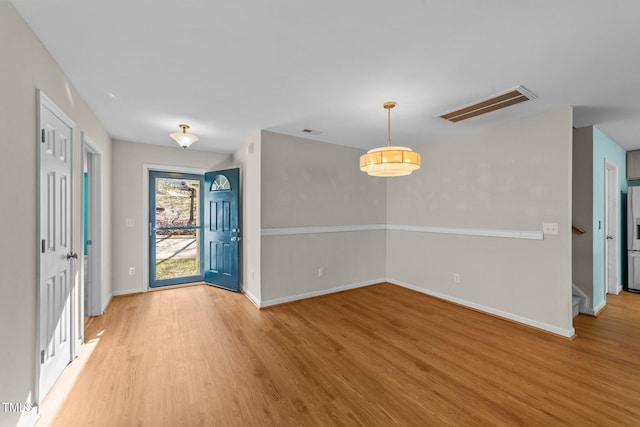 entrance foyer with light wood-type flooring