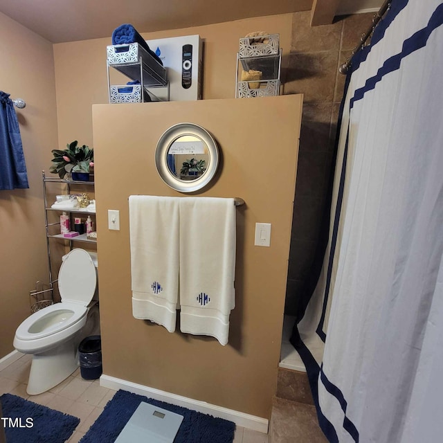 full bath featuring curtained shower, tile patterned flooring, and toilet