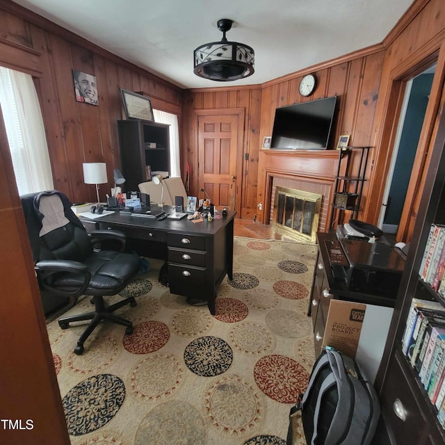 office space featuring a glass covered fireplace and wooden walls