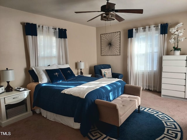 carpeted bedroom featuring a ceiling fan