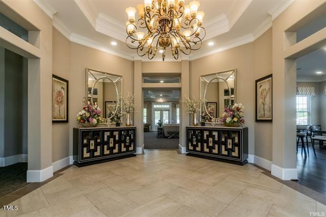 1009 Manorhaven Dr, Durham, NC 27703 - hall with a chandelier, a tray ceiling, crown molding, and recessed lighting