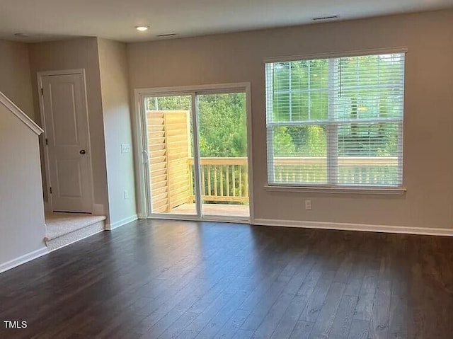 1009 Manorhaven Dr, Durham, NC 27703 - unfurnished room with dark wood-style floors and baseboards