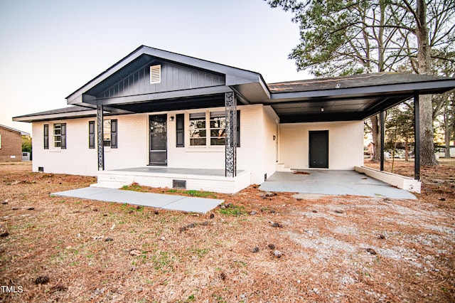 view of front facade with a carport and a porch