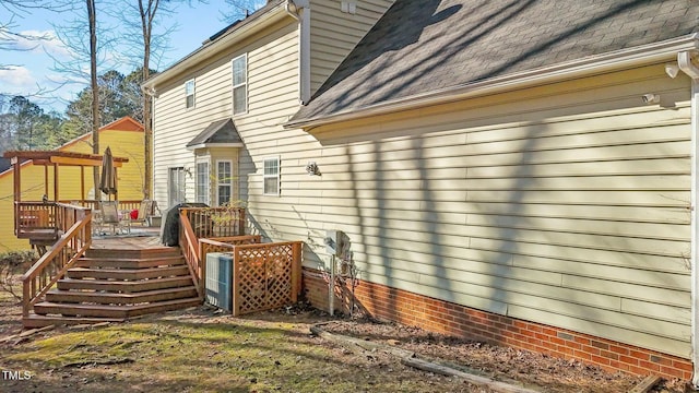 back of property featuring a deck