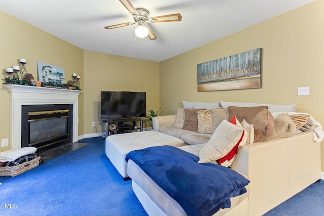 carpeted living room featuring ceiling fan and a textured ceiling