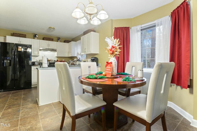 dining room featuring an inviting chandelier