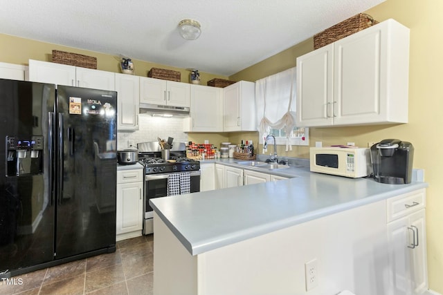 kitchen featuring white cabinetry, black refrigerator with ice dispenser, sink, and stainless steel gas range