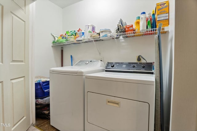 washroom featuring washer and dryer and tile patterned floors