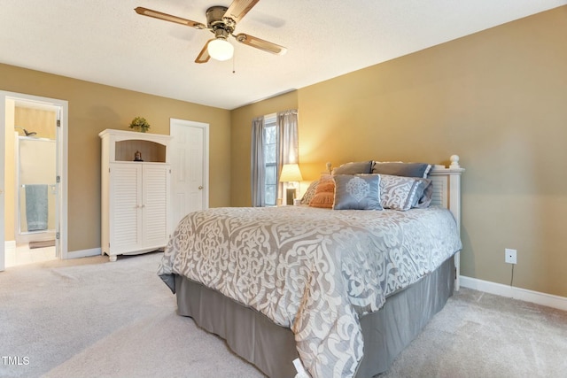 carpeted bedroom featuring ceiling fan and connected bathroom