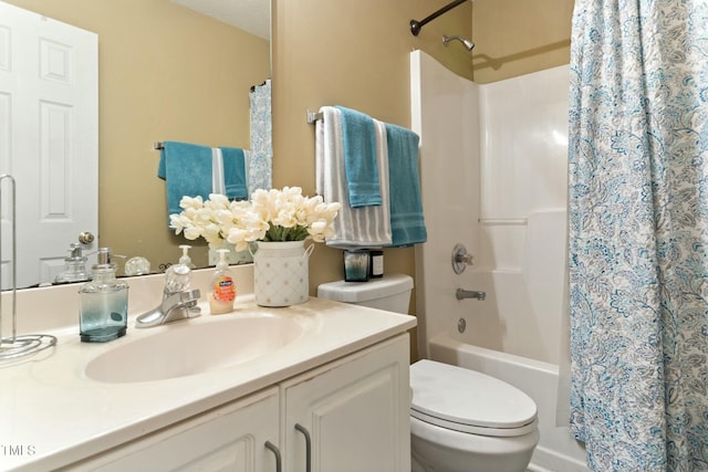 bathroom featuring vanity, a textured ceiling, and toilet