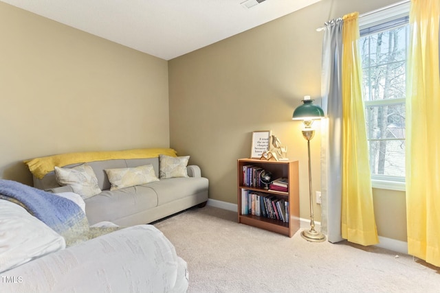 living room with plenty of natural light and light carpet