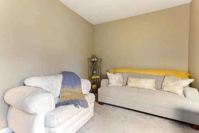 carpeted living room featuring vaulted ceiling