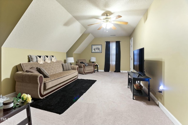 carpeted living room featuring a textured ceiling, vaulted ceiling, and ceiling fan