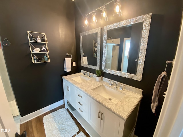 bathroom featuring hardwood / wood-style floors and vanity