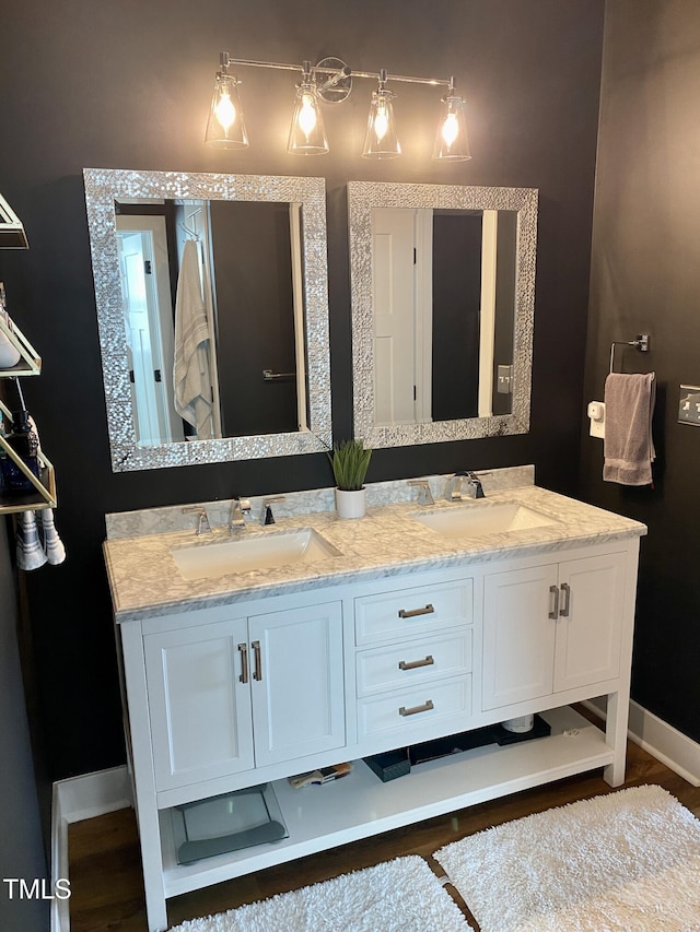 bathroom featuring vanity and wood-type flooring