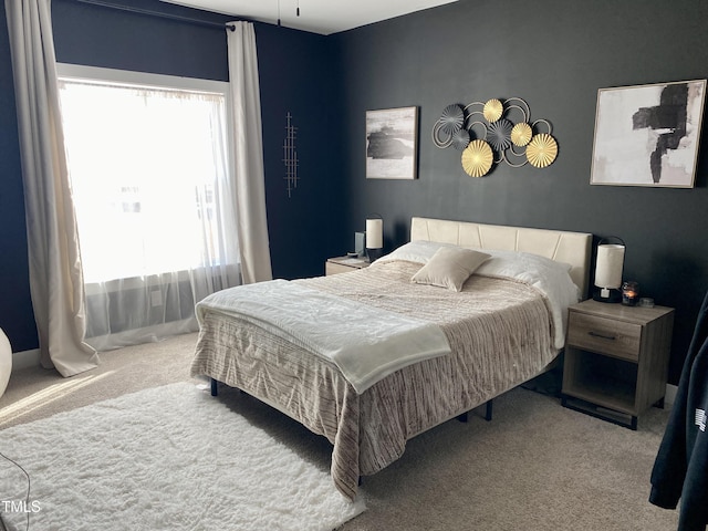 carpeted bedroom with multiple windows