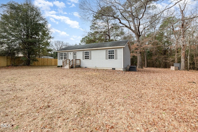 manufactured / mobile home featuring a shed and central AC