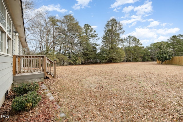 view of yard with a wooden deck