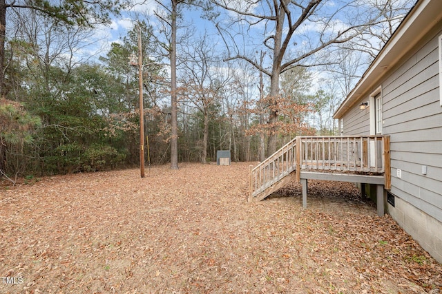 view of yard with a wooden deck