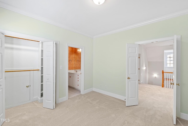 unfurnished bedroom featuring light colored carpet, crown molding, sink, connected bathroom, and lofted ceiling