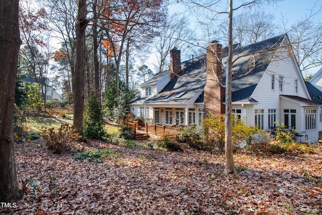 view of property exterior featuring a deck