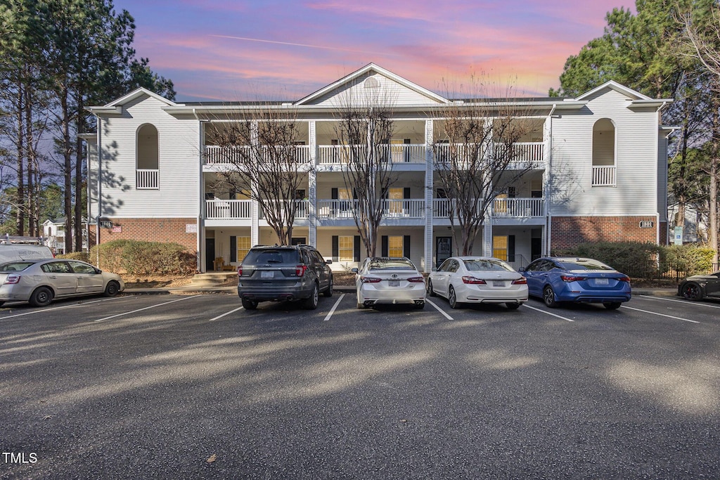 view of outdoor building at dusk