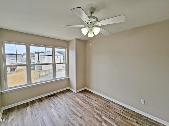 spare room with ceiling fan and light hardwood / wood-style floors