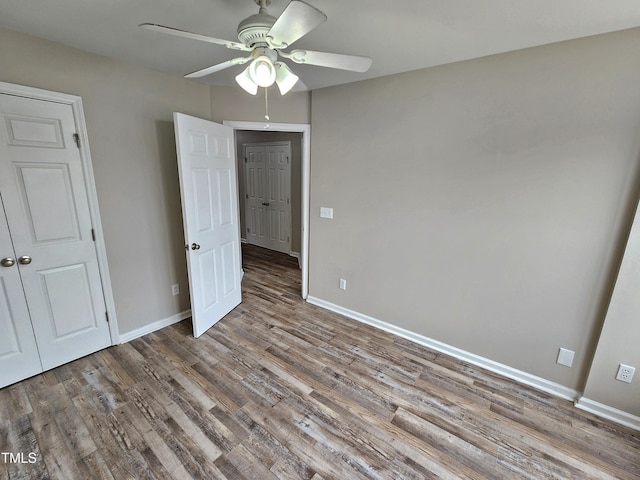 unfurnished bedroom with ceiling fan and light wood-type flooring