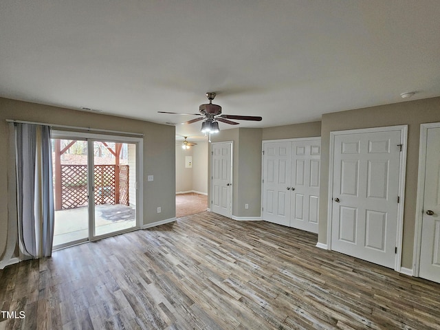 unfurnished room with wood-type flooring and ceiling fan