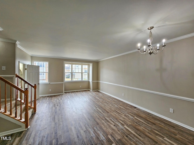 unfurnished room featuring dark hardwood / wood-style floors, an inviting chandelier, and ornamental molding