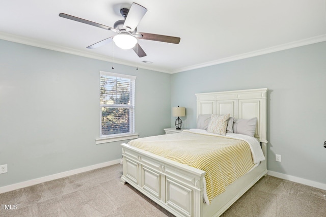 bedroom with ceiling fan, light colored carpet, and ornamental molding