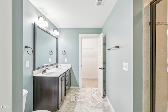 bathroom with an enclosed shower and vanity