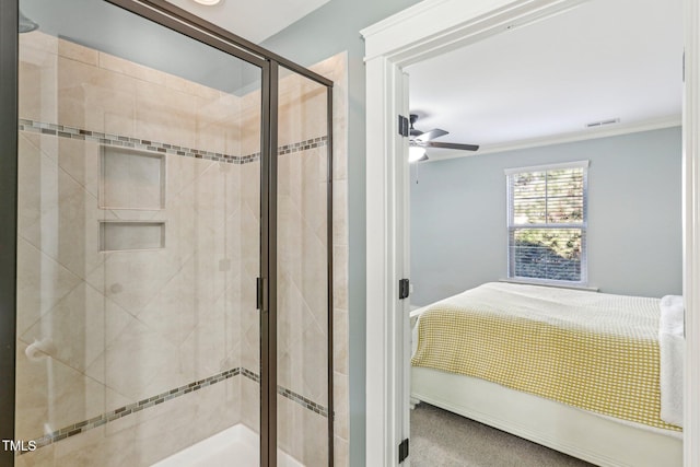 bathroom featuring ceiling fan, an enclosed shower, and crown molding