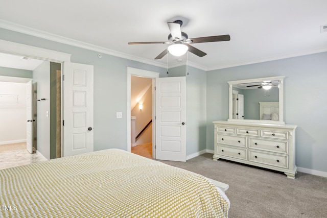 bedroom with light carpet, ceiling fan, and crown molding