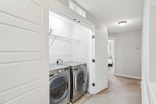 laundry area with washing machine and dryer