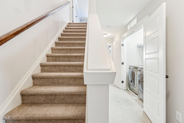 stairway with washer and dryer and carpet floors