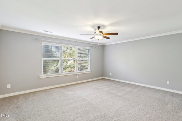 unfurnished room with light carpet, ceiling fan, and ornamental molding