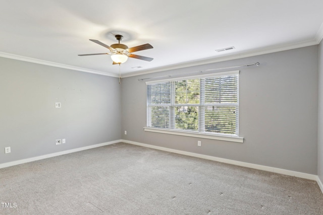 unfurnished room with ceiling fan, carpet flooring, and crown molding