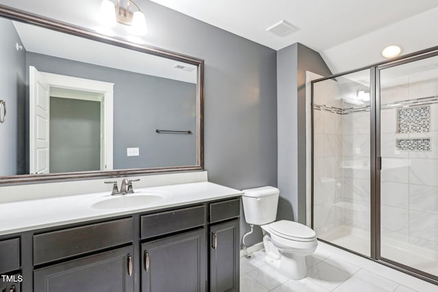 bathroom with walk in shower, vanity, and toilet