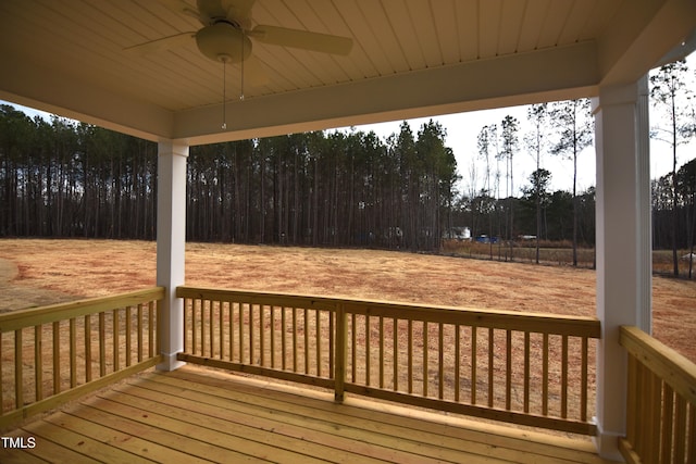 wooden terrace featuring a ceiling fan