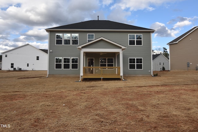 rear view of property with a deck