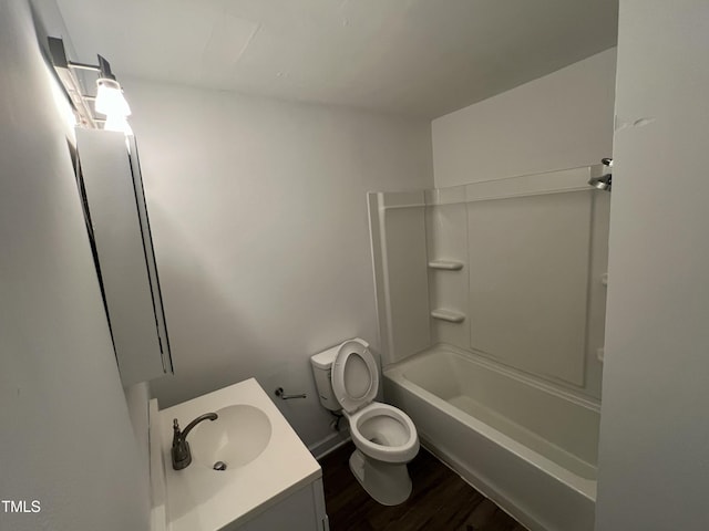 full bathroom with vanity, toilet, wood-type flooring, and shower / washtub combination