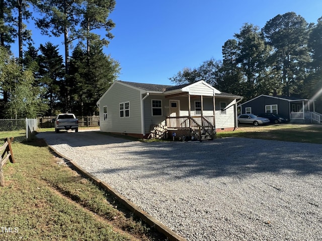 single story home with covered porch