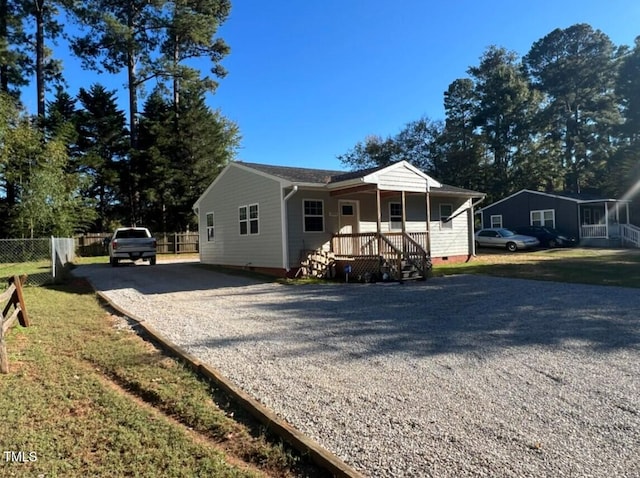 single story home with covered porch