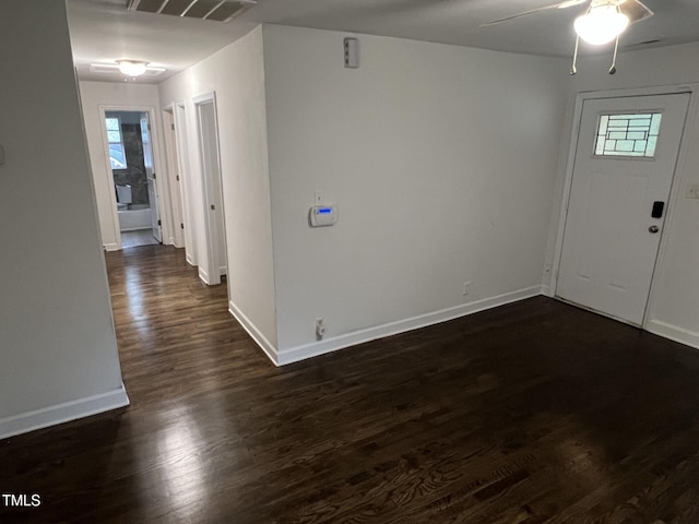 entrance foyer featuring ceiling fan and dark wood-type flooring